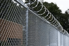 Why Are More Commerce Businesses Investing in Barbed Wire Installation Instead of Higher Fences?